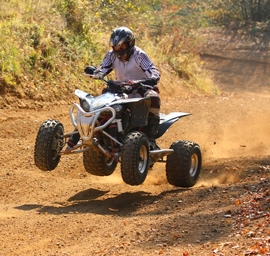 Quad motorbike rider jumps